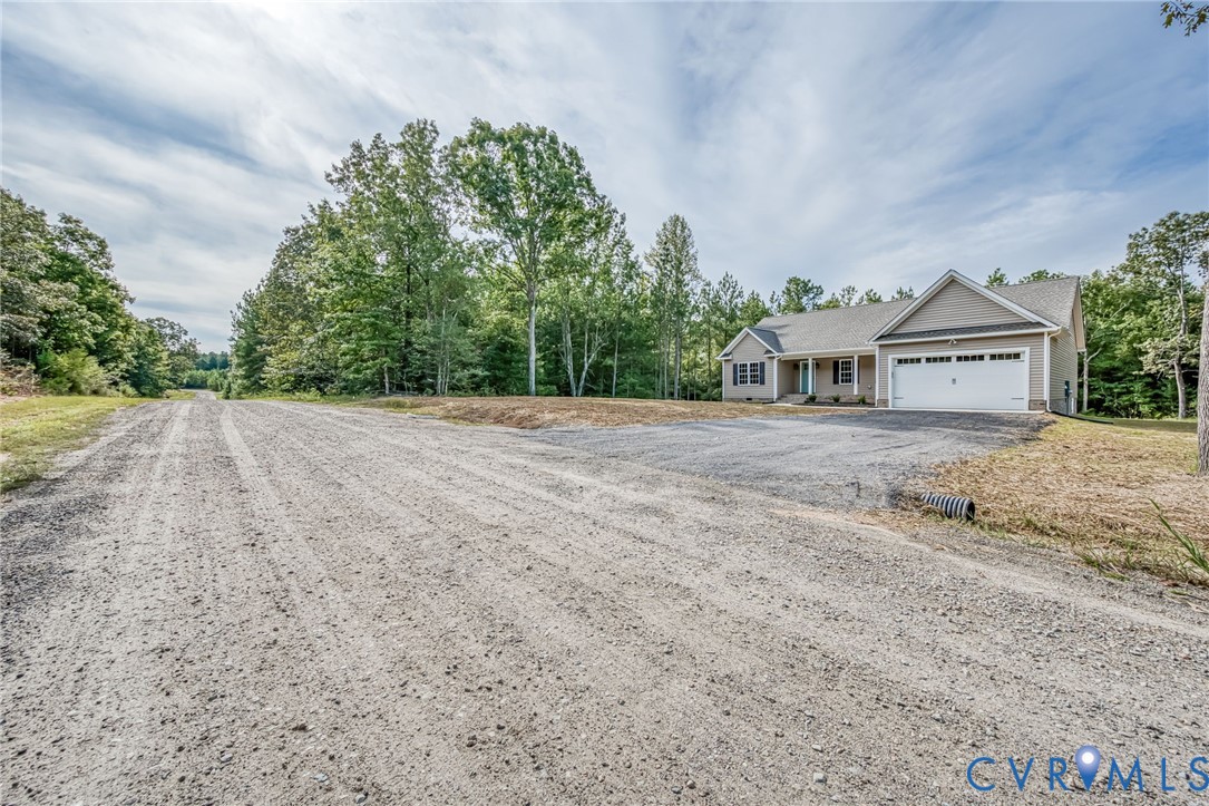 1900 Moody Fox Lane Carson, VA 23830 - Photo 2 of 38 a view of an house with backyard and bushes