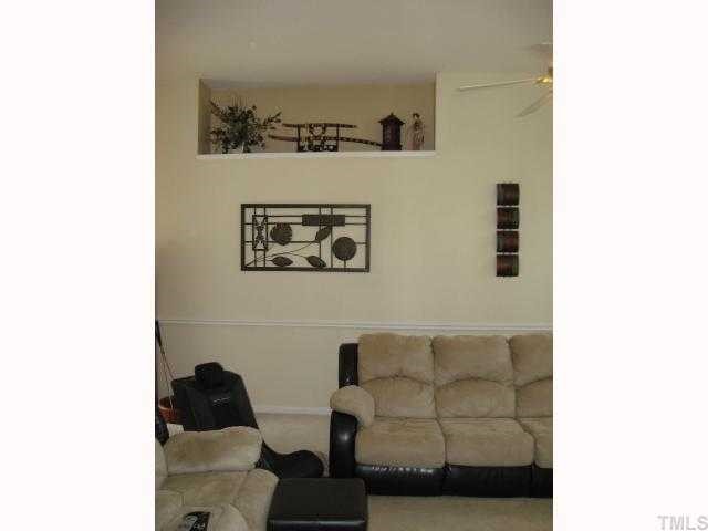 4141 Mantua Way Raleigh, NC 27604 - Photo 4 of 7 a living room with furniture and wall painting