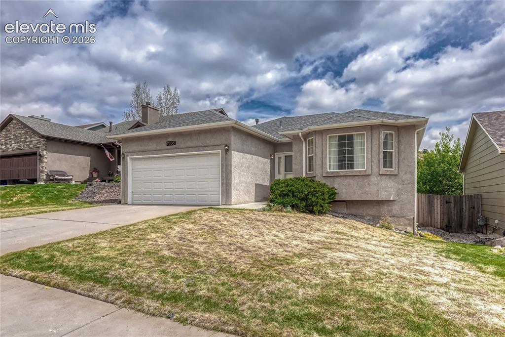 7285 Julynn Road Colorado Springs, CO 80919 - Photo 2 of 45 a front view of house with yard