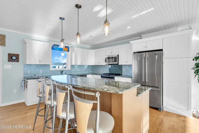 a living room with furniture fireplace and a flat screen tv
