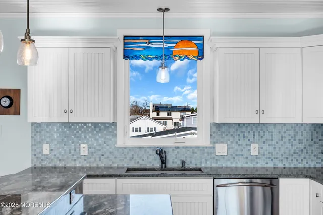 a view of a patio with table and chairs