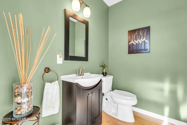 a living room with furniture a flat screen tv and a table