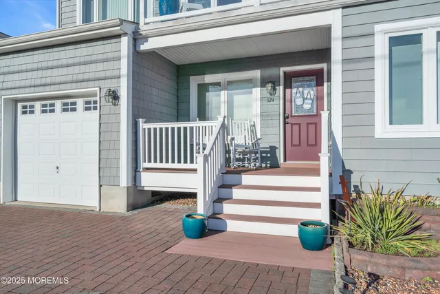 a view of staircase with white walls and windows