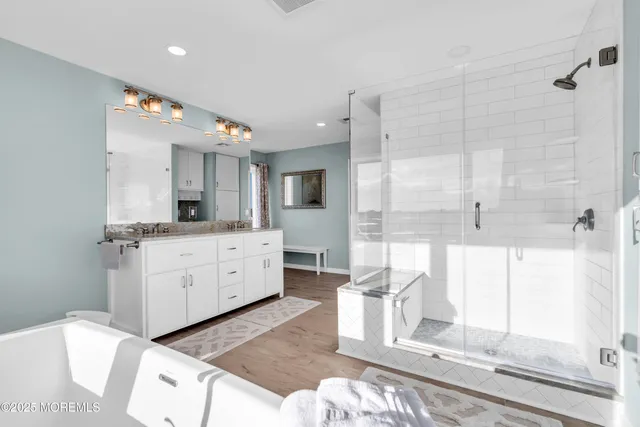 an aerial view of residential houses with outdoor space and parking