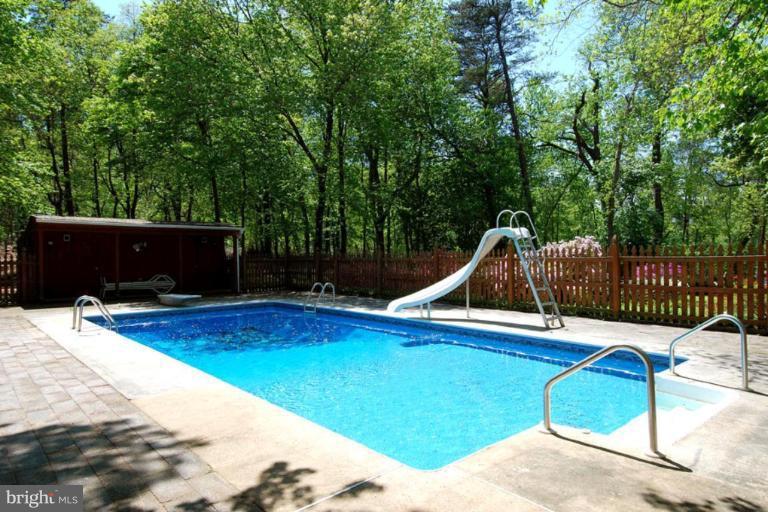 1907 Ridgewood Road Hanover, MD 21076 - Photo 11 of 30 a view of backyard with swimming pool and seating space