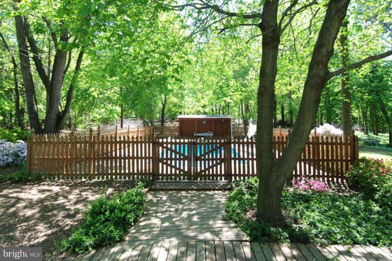 1907 Ridgewood Road Hanover, MD 21076 - Photo 24 of 30 a view of a house with a fence and trees
