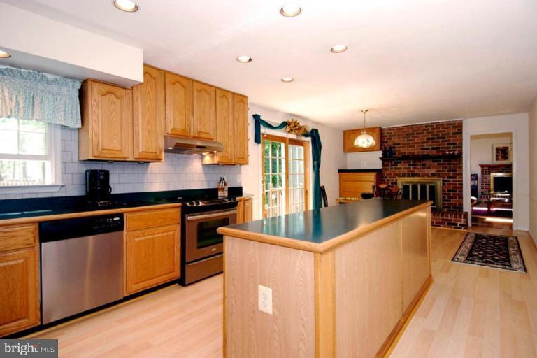 1907 Ridgewood Road Hanover, MD 21076 - Photo 27 of 30 a kitchen with stainless steel appliances granite countertop a stove a sink and a refrigerator