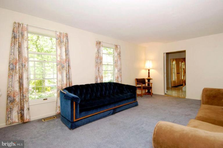 1907 Ridgewood Road Hanover, MD 21076 - Photo 8 of 30 a living room with a couch and a dresser next to a window