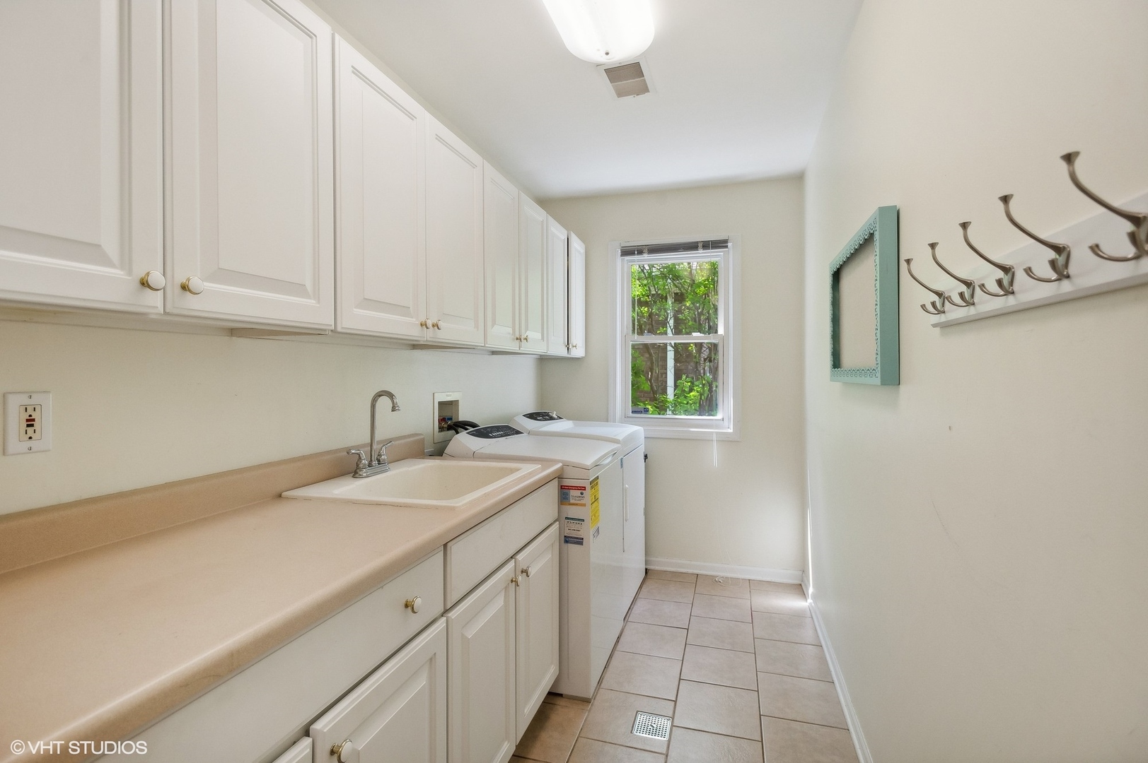 3951 Rutgers Lane Northbrook, IL 60062 - Photo 11 of 22 a kitchen with a sink cabinets and window
