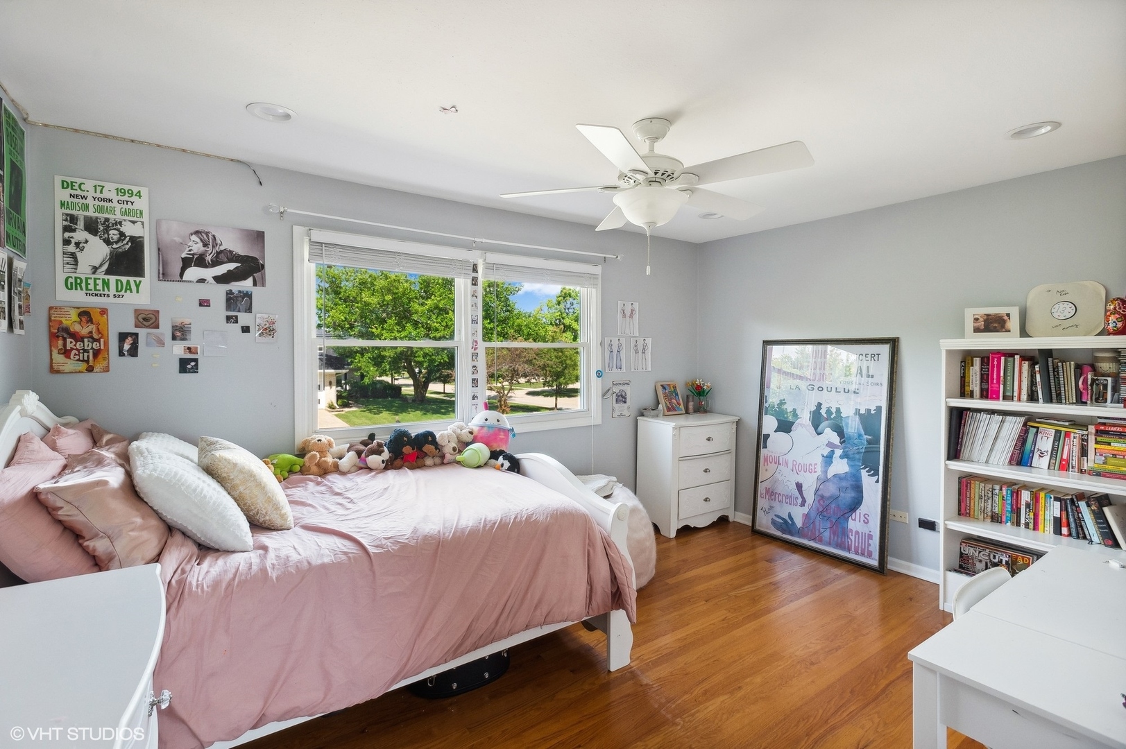 3951 Rutgers Lane Northbrook, IL 60062 - Photo 16 of 22 a bed room with a bed a book shelf and a window