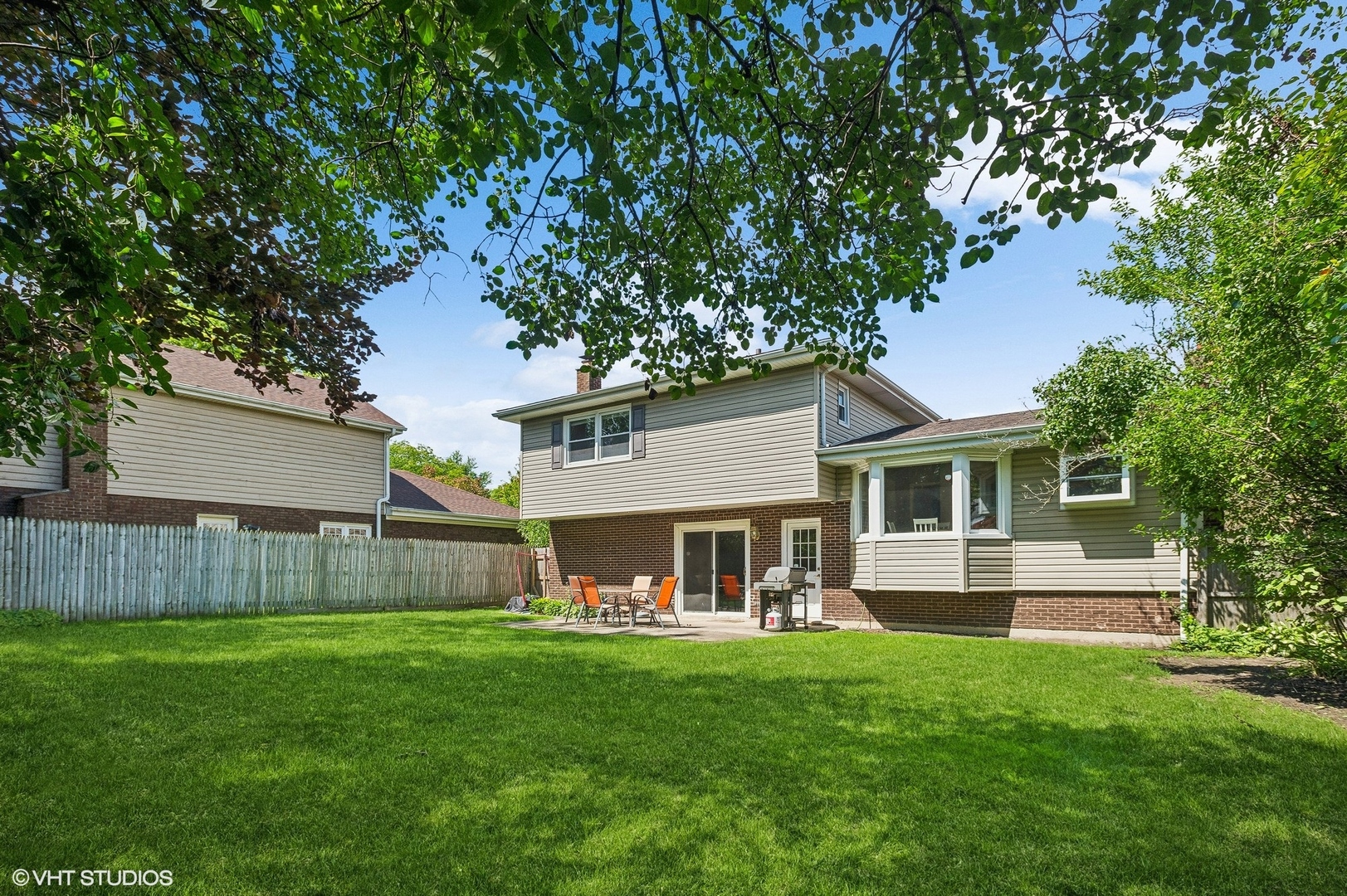 3951 Rutgers Lane Northbrook, IL 60062 - Photo 22 of 22 a front view of house with yard and outdoor seating