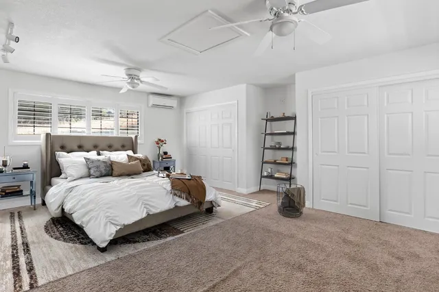 a white refrigerator freezer and a stove sitting inside of a kitchen