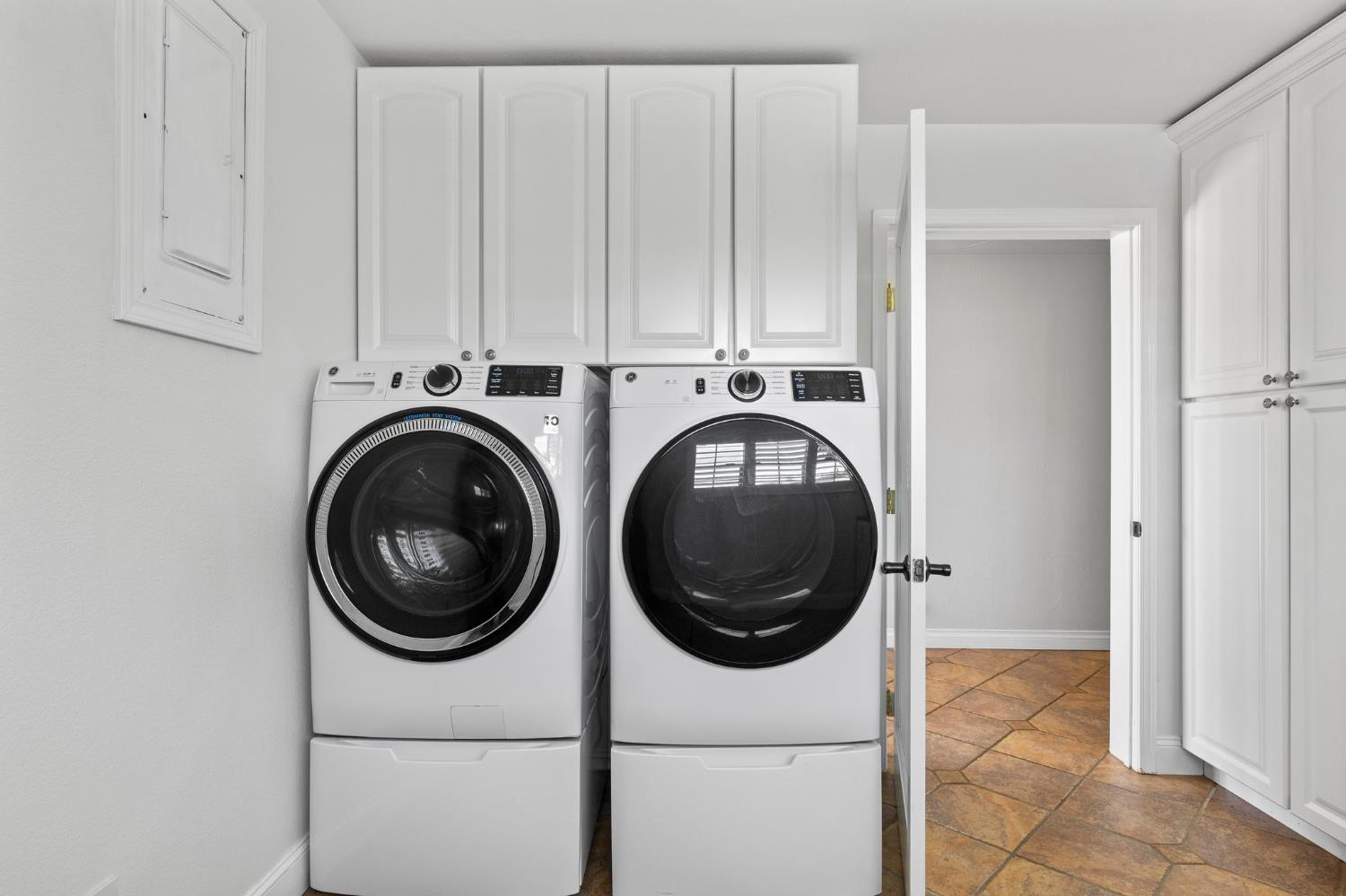 20160 Latrobe Road Plymouth, CA 95669 - Photo 18 of 37 a view of a hallway with washer and dryer