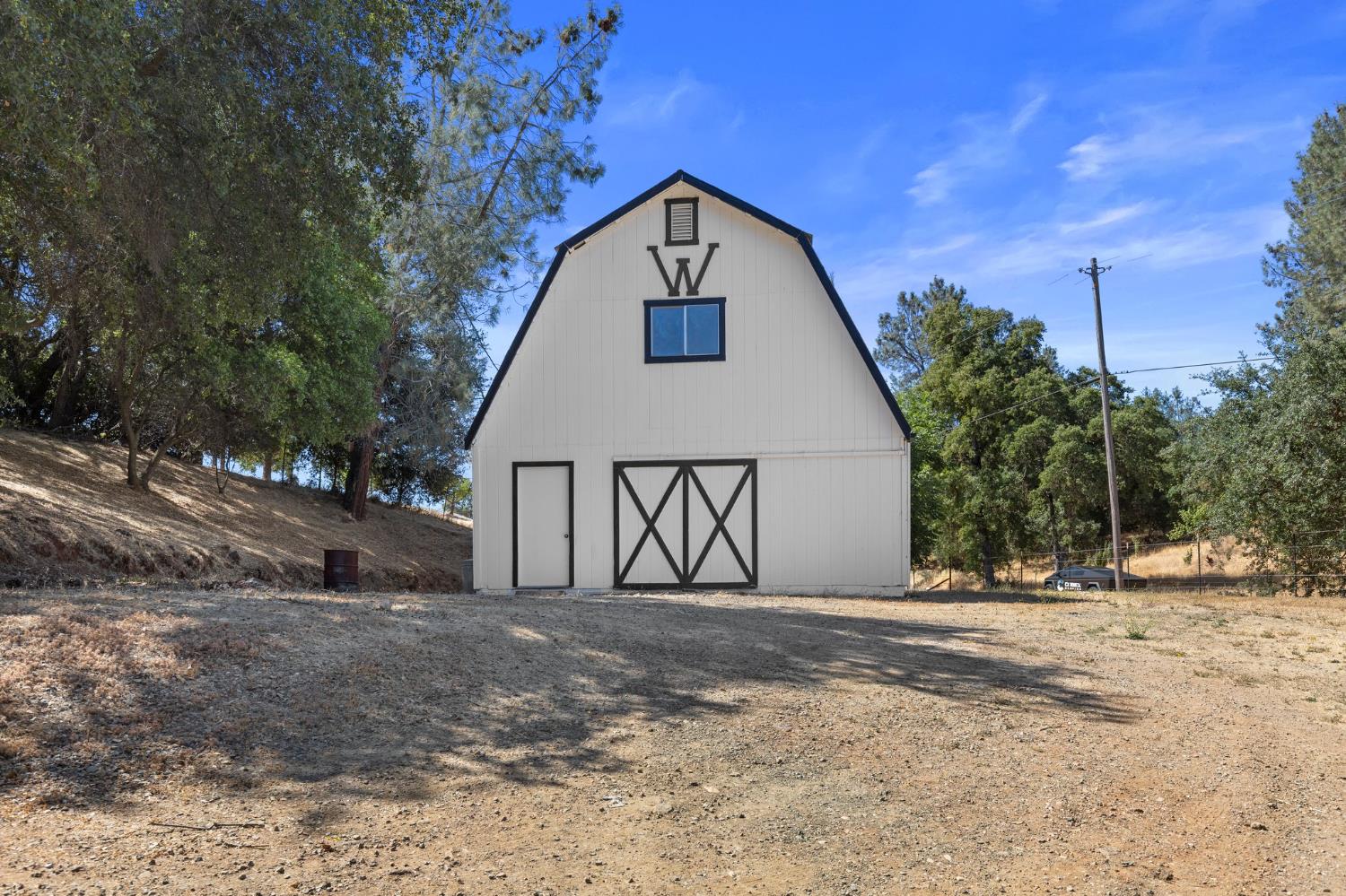 20160 Latrobe Road Plymouth, CA 95669 - Photo 31 of 37 a front view of a house with a yard