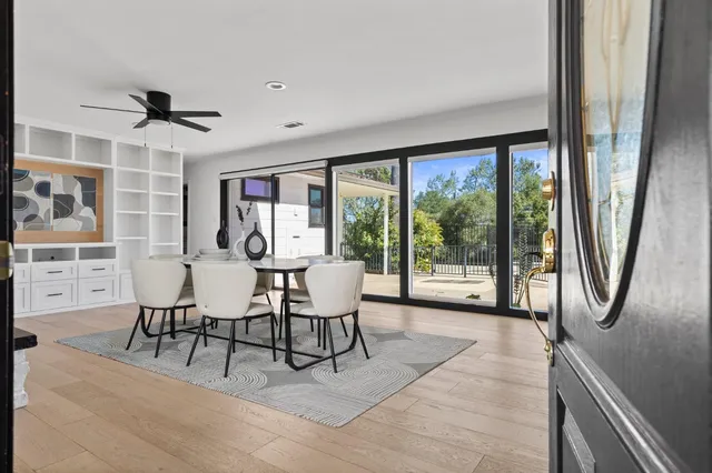 a view of a dining room with furniture window and outside view