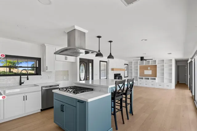 a kitchen with a table and chairs
