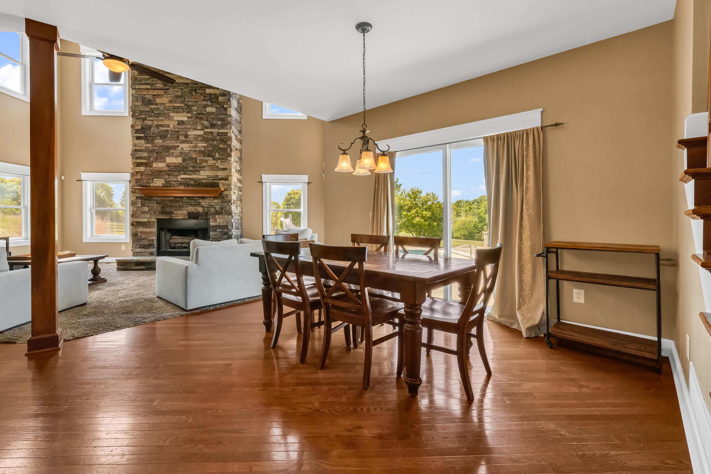 16689 Bailor Road Laurelville, OH 43135 - Photo 22 of 73 • Hardwood flooring
• Tan painted walls
• Chandelier
• Double sliding
doors to patio