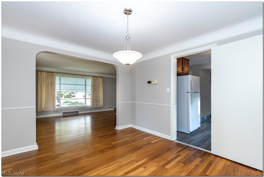 1029 Avondale Road Cleveland, OH 44121 - Photo 5 of 35 Airy flow of Living Room, Dining Room and Kitchen