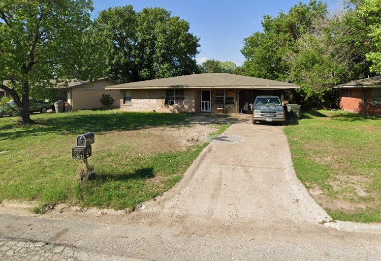 Tbd Truman Street Bryan, TX 77801 - Photo 8 of 13 a front view of a house with a garden