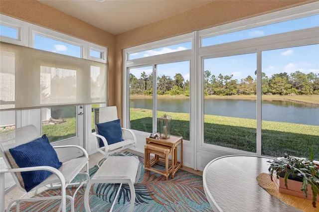 an aerial view of residential houses with outdoor space and swimming pool
