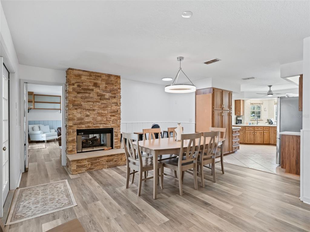 8916 Southwest 8th Street Ocala, FL 34481 - Photo 12 of 40 a dining room with furniture and wooden floor
