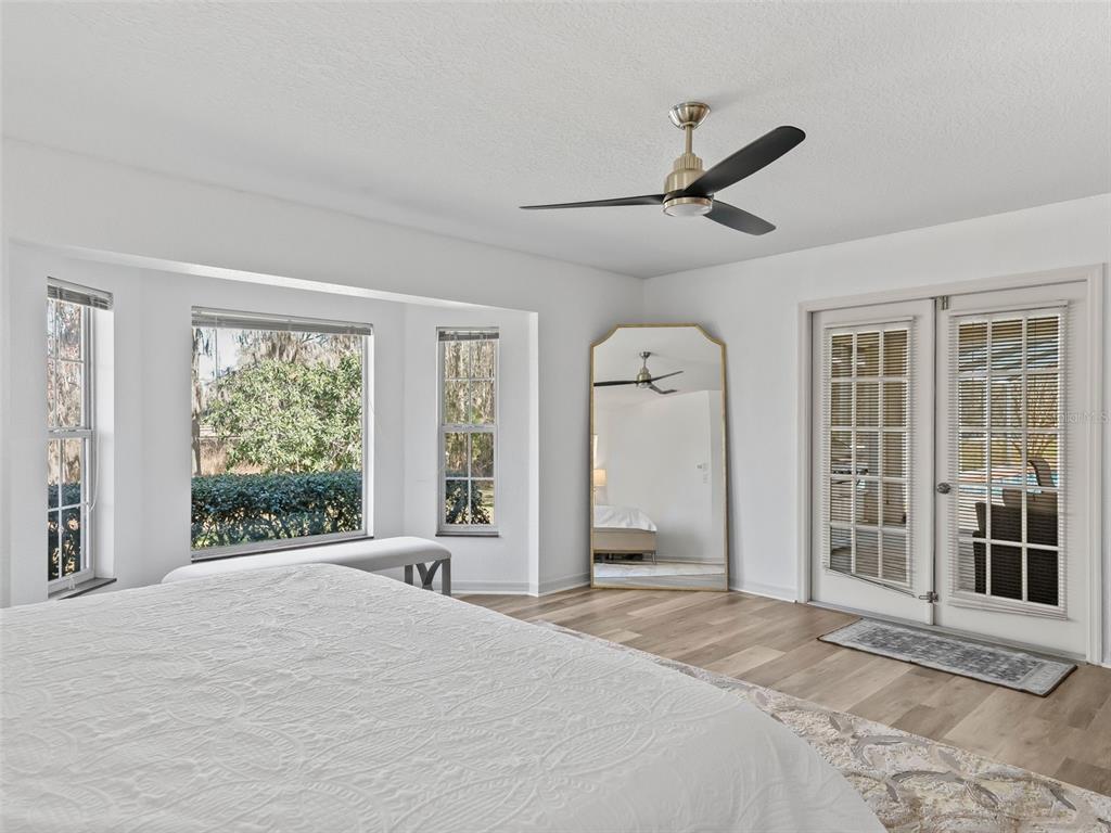 8916 Southwest 8th Street Ocala, FL 34481 - Photo 18 of 40 a bedroom with a bed and a large window