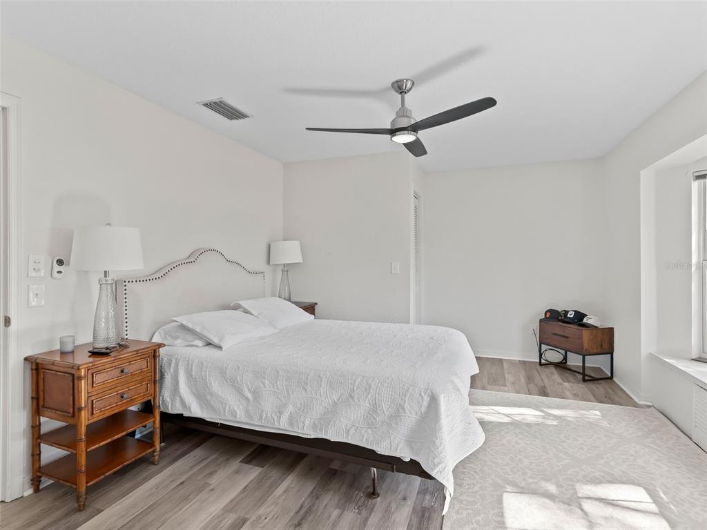 8916 Southwest 8th Street Ocala, FL 34481 - Photo 23 of 40 a bedroom with a bed and a table in it