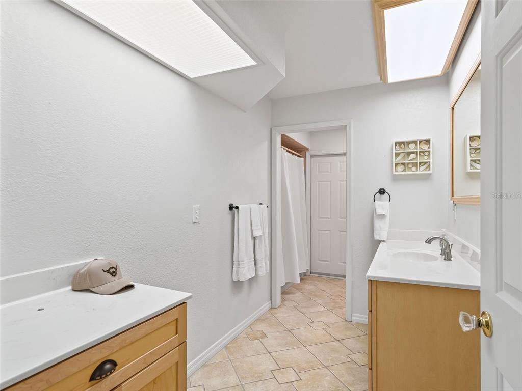 8916 Southwest 8th Street Ocala, FL 34481 - Photo 27 of 40 a bathroom with a sink and a tub