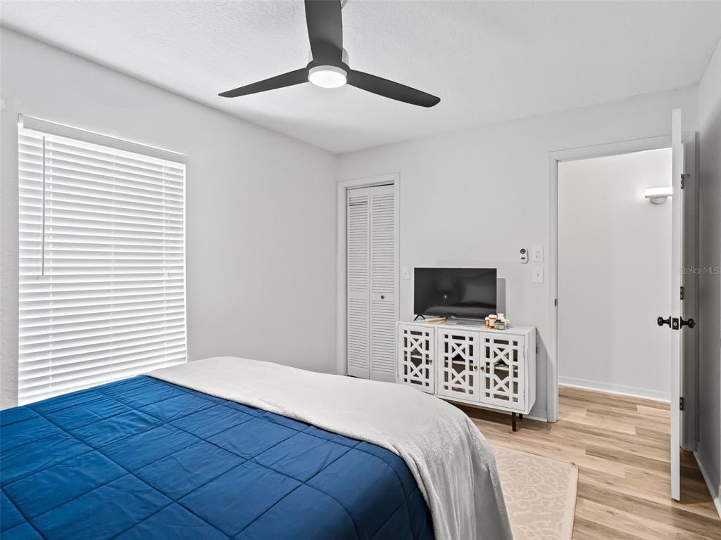 8916 Southwest 8th Street Ocala, FL 34481 - Photo 29 of 40 a bedroom with a bed and a flat screen tv