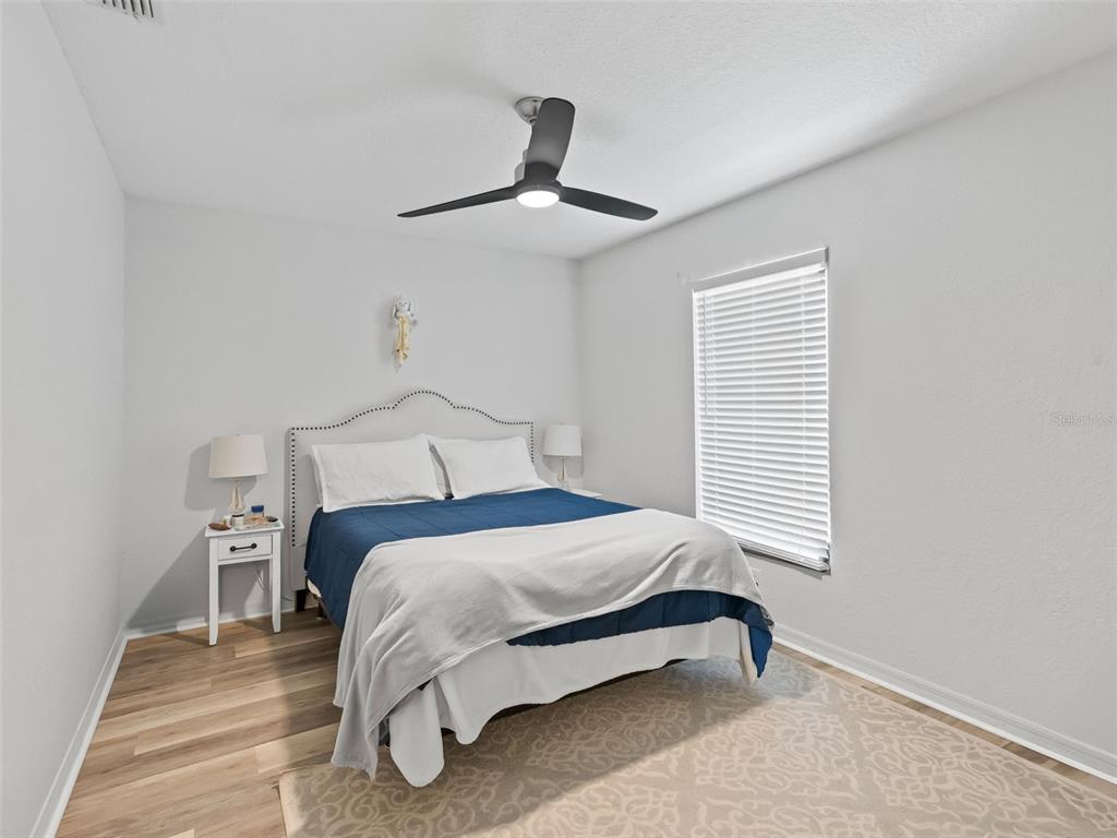 8916 Southwest 8th Street Ocala, FL 34481 - Photo 30 of 40 a bedroom with a bed and a window