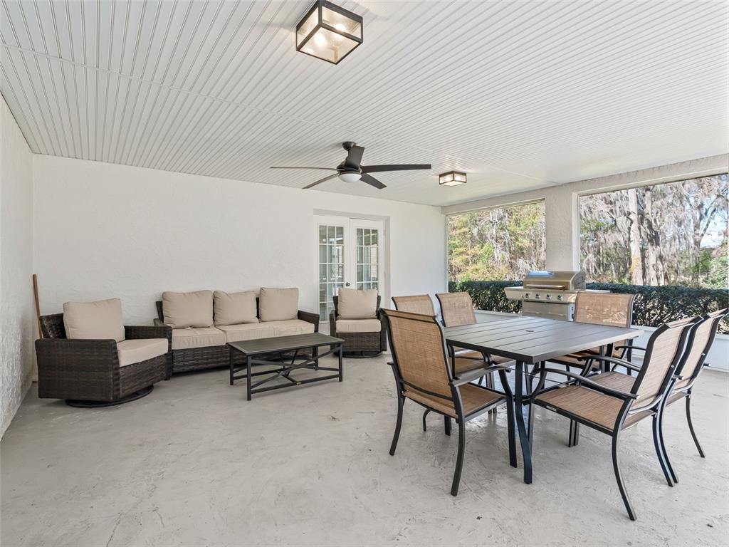 8916 Southwest 8th Street Ocala, FL 34481 - Photo 33 of 40 a living room with furniture and a large window