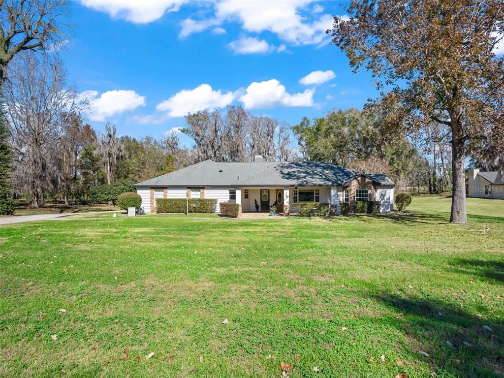 8916 Southwest 8th Street Ocala, FL 34481 - Photo 40 of 40 a front view of a house with garden