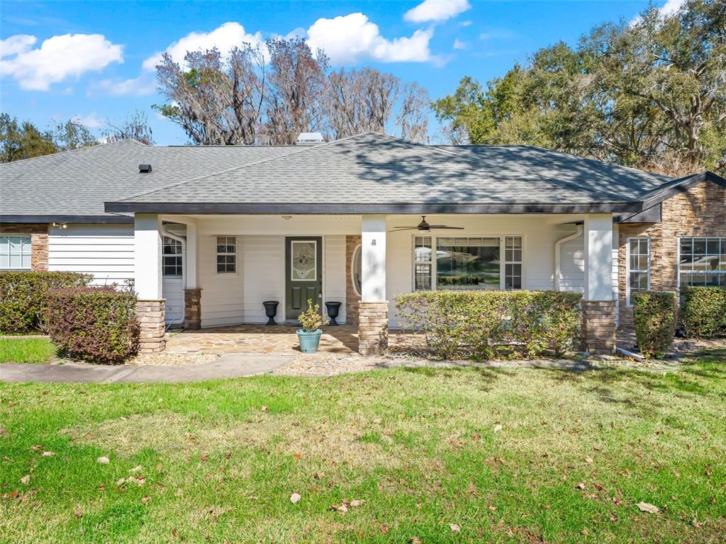 8916 Southwest 8th Street Ocala, FL 34481 - Photo 4 of 40 a house view with a garden space