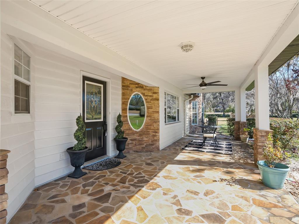 8916 Southwest 8th Street Ocala, FL 34481 - Photo 5 of 40 a living room with a couch and a table