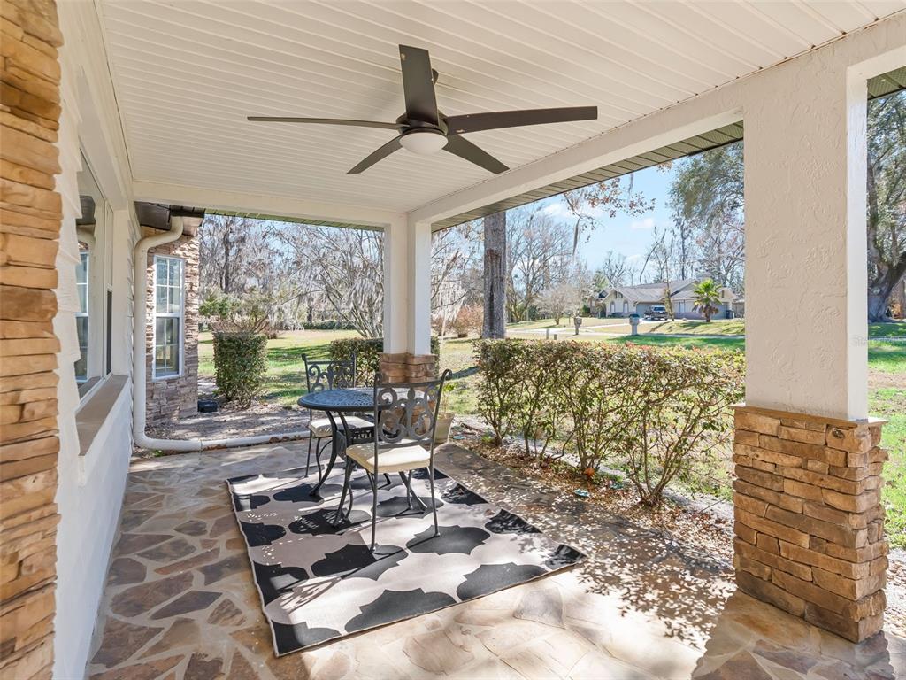 8916 Southwest 8th Street Ocala, FL 34481 - Photo 6 of 40 a living room with furniture and a large window