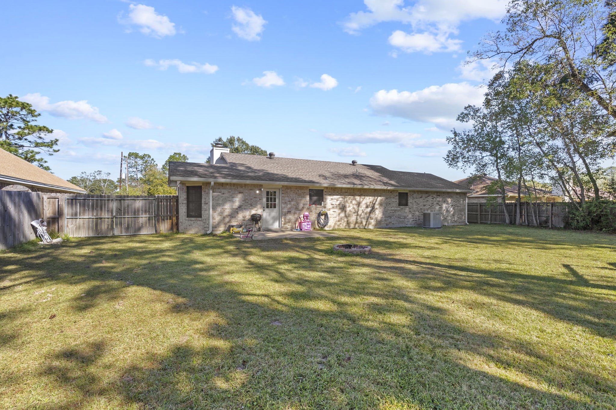 125 Williams Road Lumberton, TX 77657 - Photo 20 of 22 a view of a large building with a big yard and large trees