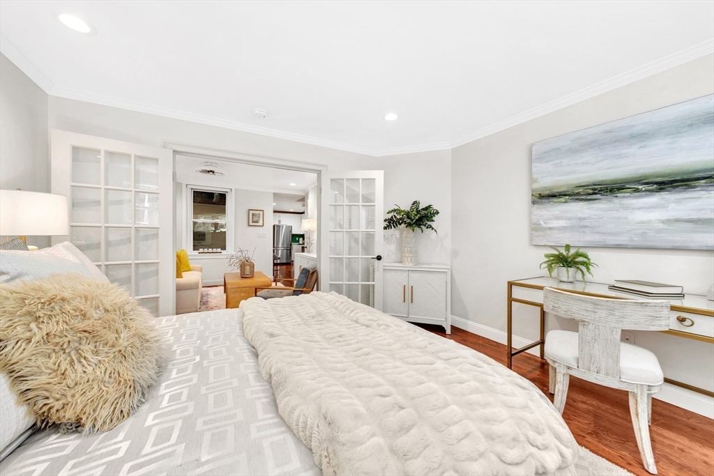 34 Clark Street, Unit 2 Boston, MA 02113 - Photo 12 of 23 a bedroom with a bed and a table in it