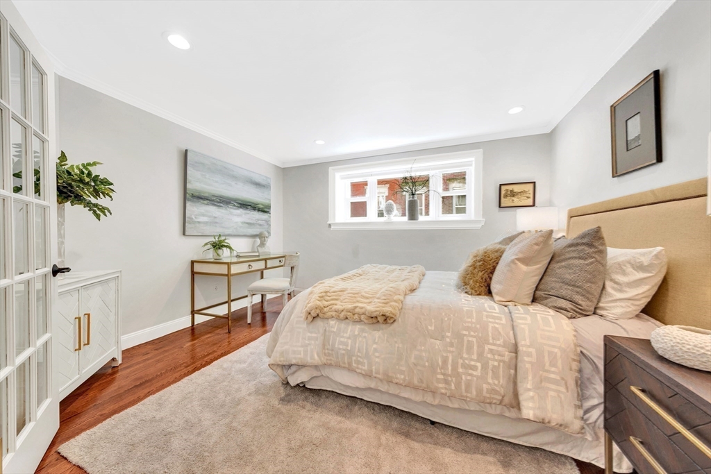 34 Clark Street, Unit 2 Boston, MA 02113 - Photo 13 of 23 a bedroom with a bed and a table