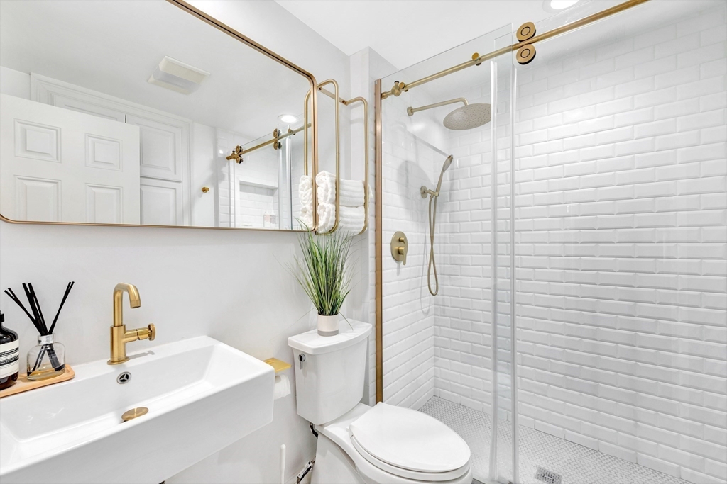 34 Clark Street, Unit 2 Boston, MA 02113 - Photo 14 of 23 a bathroom with a sink toilet and shower