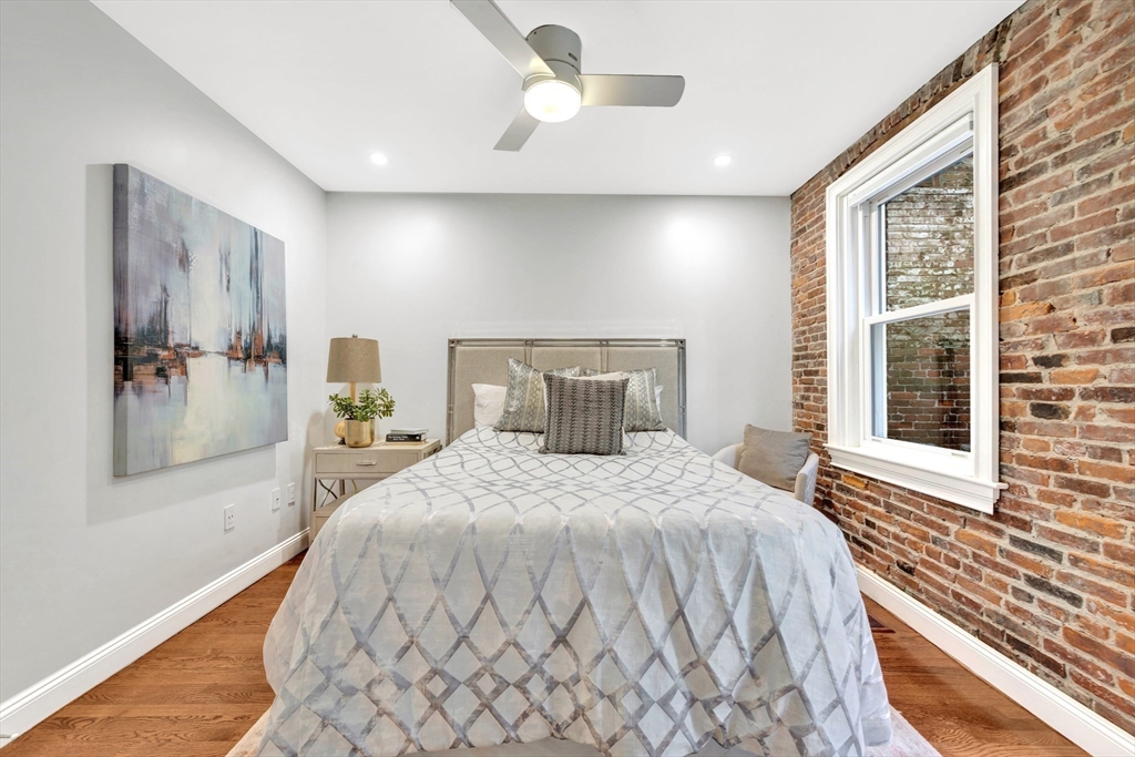 34 Clark Street, Unit 2 Boston, MA 02113 - Photo 15 of 23 a bedroom with a bed and a window