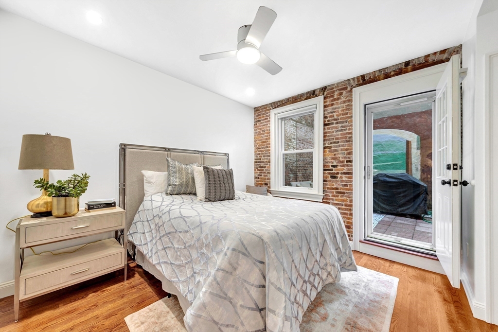 34 Clark Street, Unit 2 Boston, MA 02113 - Photo 16 of 23 a bedroom with a bed and a window