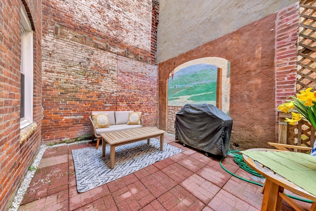 34 Clark Street, Unit 2 Boston, MA 02113 - Photo 19 of 23 a outdoor living space with furniture and a fireplace