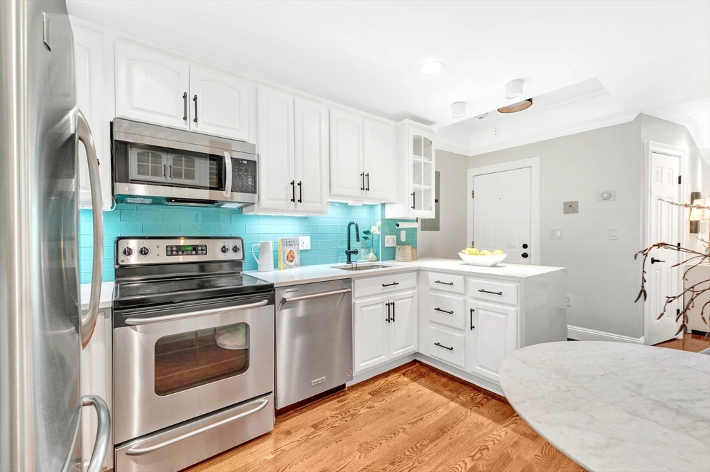 34 Clark Street, Unit 2 Boston, MA 02113 - Photo 6 of 23 a kitchen with stainless steel appliances granite countertop a stove a sink and a microwave