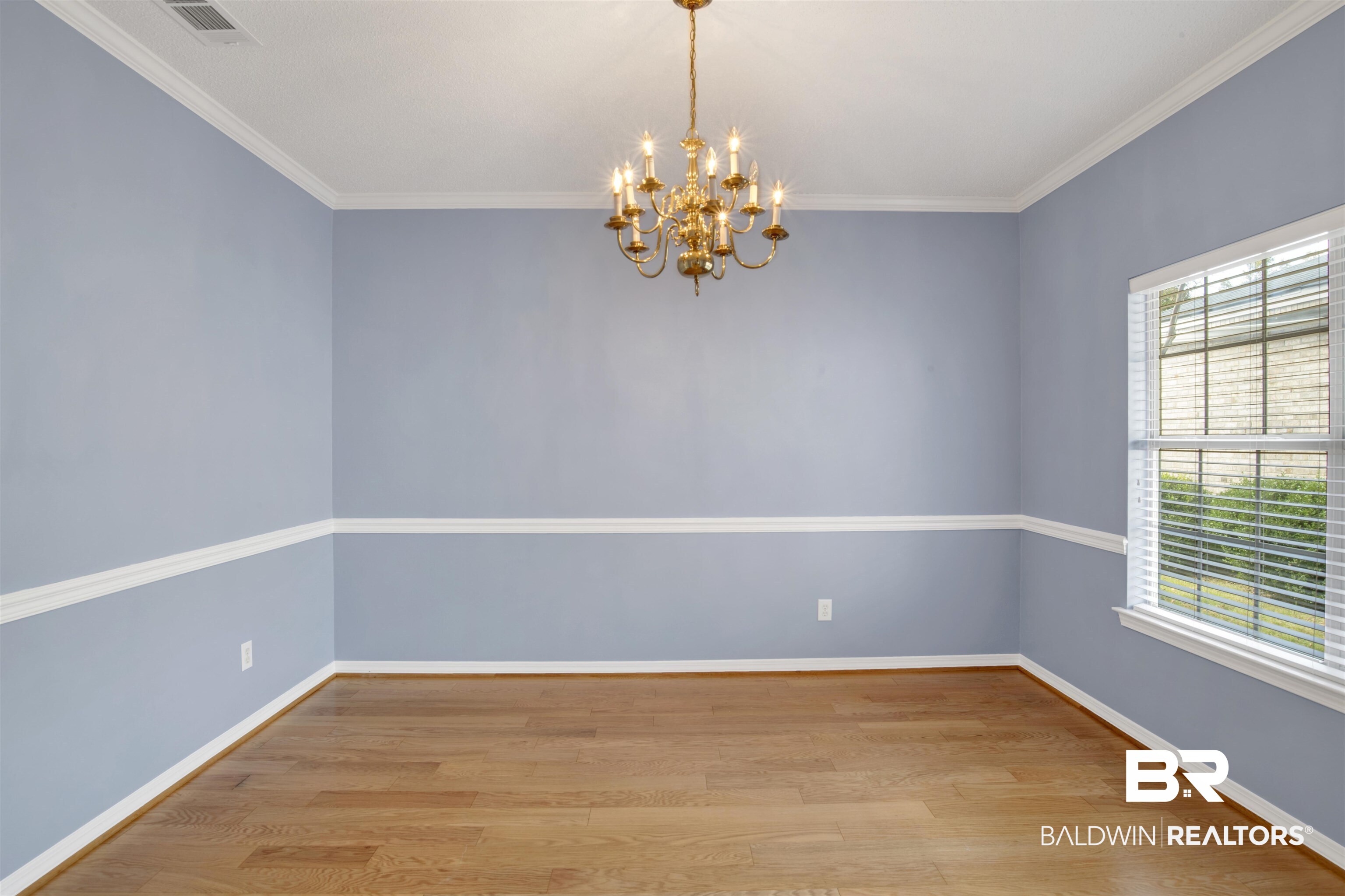 125 Woodruff Court Mobile, AL 36608 - Photo 8 of 27 Dining room featuring crown molding, a notable chandelier, and wood-type flooring