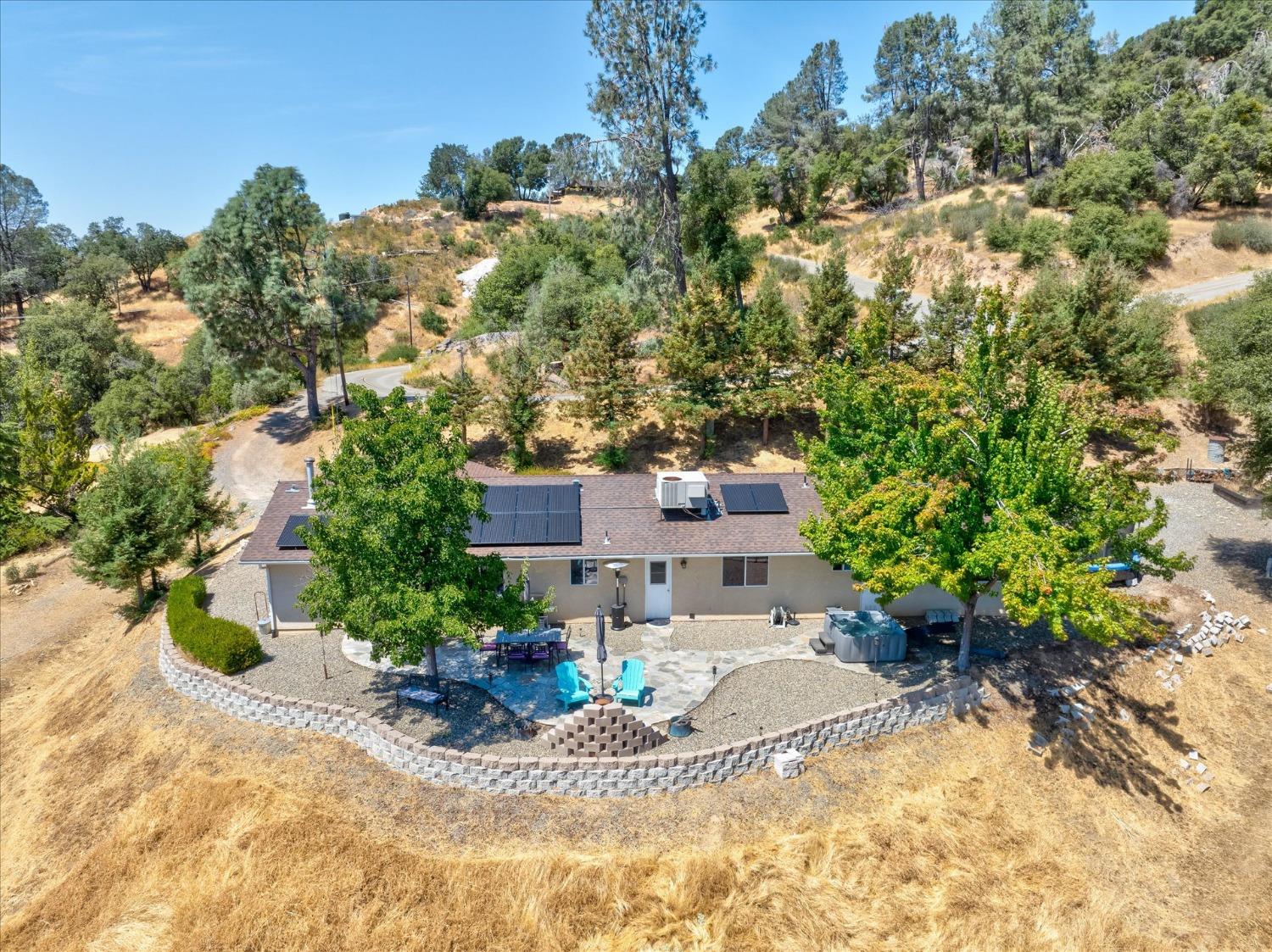 41175 Jean Road West Oakhurst, CA 93644 - Photo 1 of 43 a view of a garden with a patio