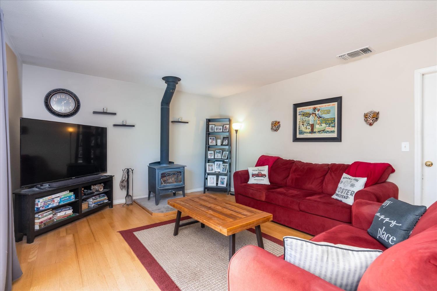 41175 Jean Road West Oakhurst, CA 93644 - Photo 13 of 43 a living room with furniture and a flat screen tv