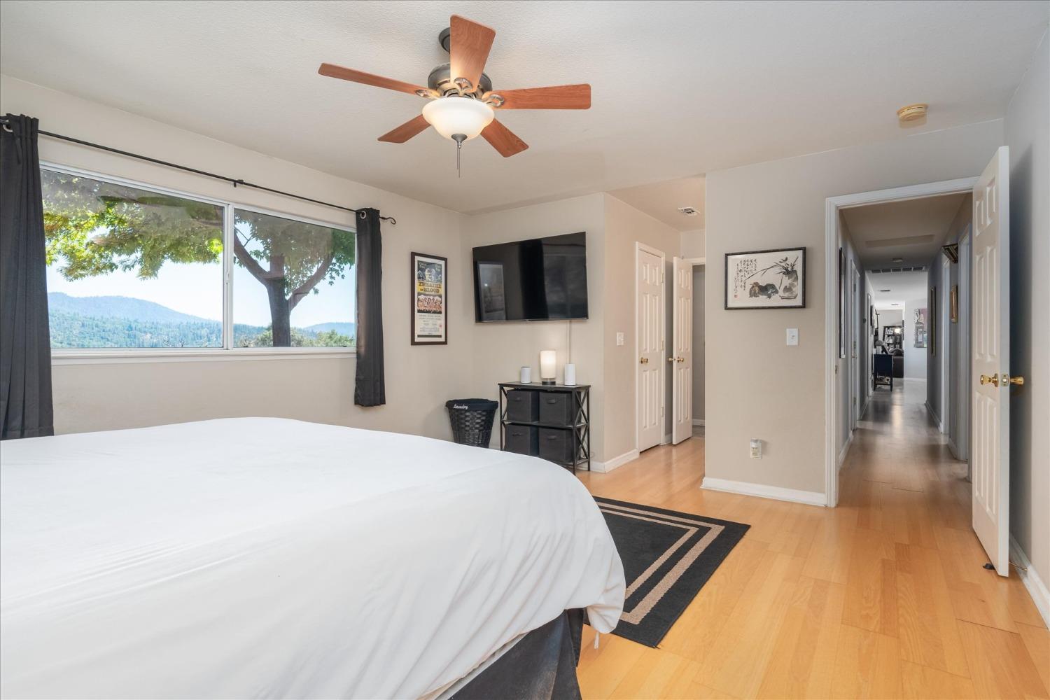 41175 Jean Road West Oakhurst, CA 93644 - Photo 20 of 43 a bedroom with a bed and a flat screen tv