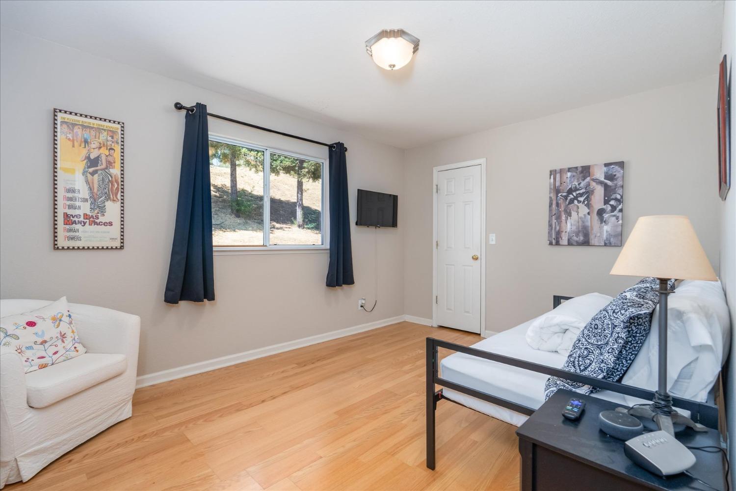 41175 Jean Road West Oakhurst, CA 93644 - Photo 25 of 43 a bedroom with furniture and a window