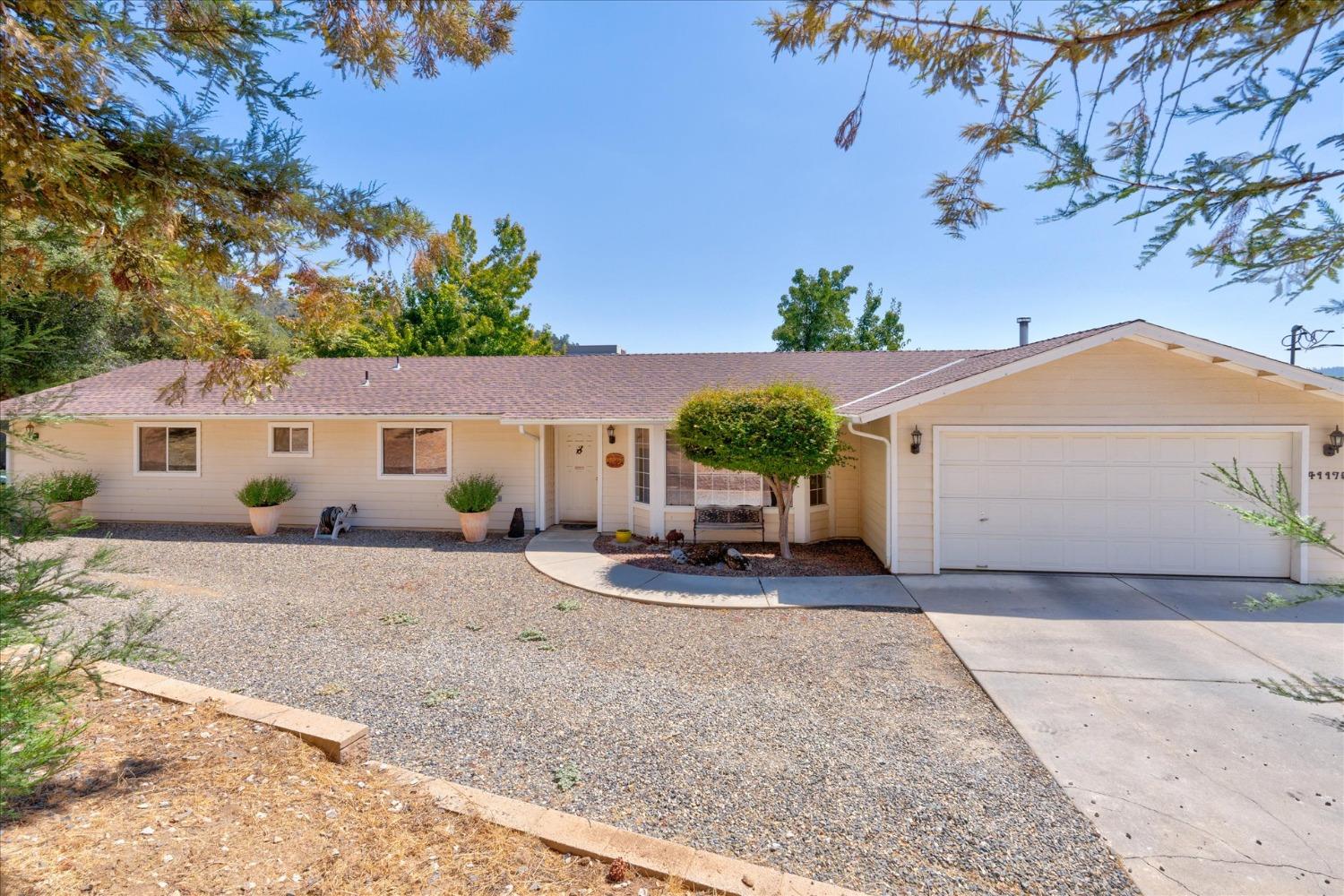 41175 Jean Road West Oakhurst, CA 93644 - Photo 35 of 43 front view of a house with a patio