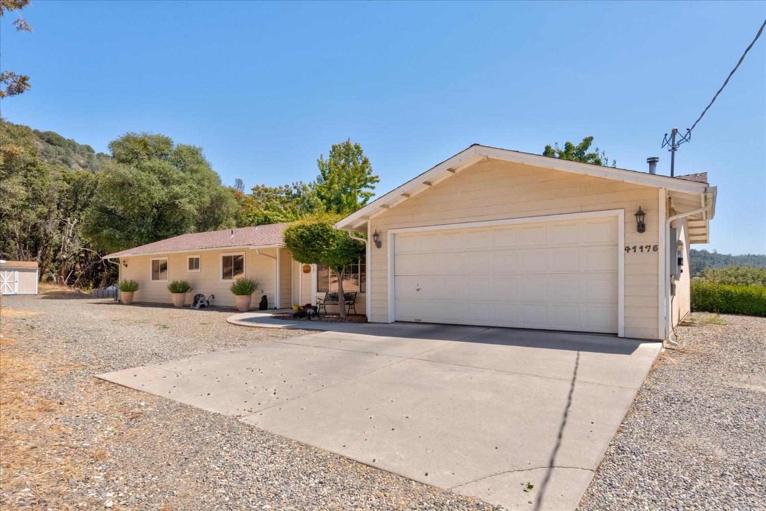 41175 Jean Road West Oakhurst, CA 93644 - Photo 37 of 43 a view of a house with a yard